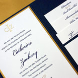 Catherine and Zachary: an elegant wedding invitation with pocket fold, monogram, and gold foil calligraphic flourishes