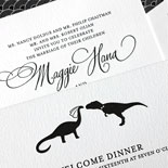 Maggie and Andrew - A classic black and white letterpress invitation with patterned envelope and playful dinosaur bride and groom illustration