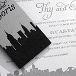 Thy and Boris: City inspired pocket folder invitation that is kept together with a custom belly band. All pieces are letterpressed on metallic paper. Shown with a digitally printed program on metallic paper