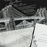 Lauren and Kevin: White foil Brooklyn Bridge on black museum board, Statue of Liberty letterpressed on white stock, map of Park Slope with a yellow heart