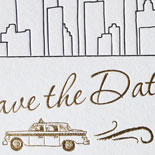 Angela and Mike: save the date featuring a NYC skyline and classic taxi custom illustration letterpressed in black ink with gold foil