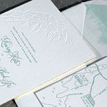 Lindsay and Randall: a floral design and ombre envelope liner evoke the Long Island beach setting for this wedding. The invitation also features gold foil edging, hand calligraphy and a custom illustrated map.