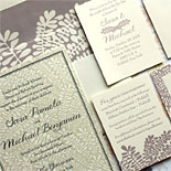 Sara and Michael - floral patterns beautifully play off each other on this romantic wedding invitation. Design by Bella Figura.