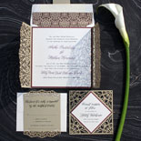 Anthi and Stephen - A pattern rich laser cut invitation on layered metallic card stock with dramatic gatefold